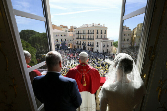 pope-leo-xiv-princess-charlene-of-monaco-prince-albert-ii-of-monaco-greet-the-crowd-from-the-balcony-of-the-princes-palace-during-the-pope-leo-xivs-visit-to-monaco-on-march-28-2026-this-visit-is