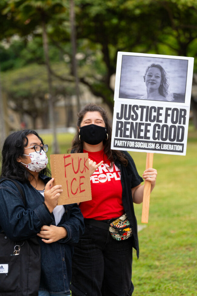 protester-holds-justice-for-renee-good-sign-as-demonstrators-rally-against-ice-as-the-no-kings-movement-calls-for-political-change