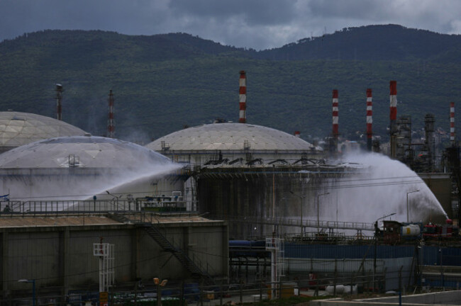 firefighters-work-to-extinguish-a-fire-at-the-site-of-an-iranian-missile-strike-in-haifa-israel-monday-march-30-2026-ap-photoariel-schalit