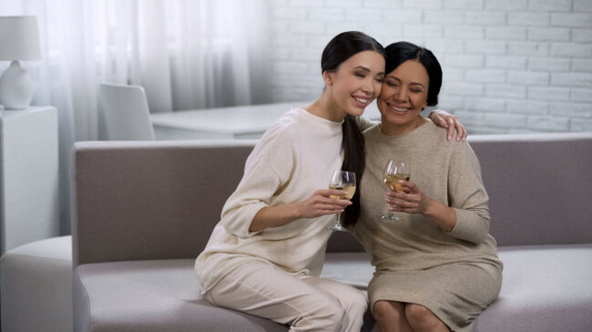 attractive-asian-women-hugging-drinking-white-wine-hen-party-celebration