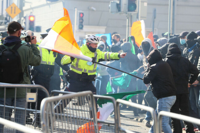 members-of-an-garda-order-counter-demonstrators-to-retreat-during-an-anti-lockdown-protest-outside-leinster-house-dublin-as-ireland-continues-to-be-at-a-nationwide-level-3-coronavirus-lock-down