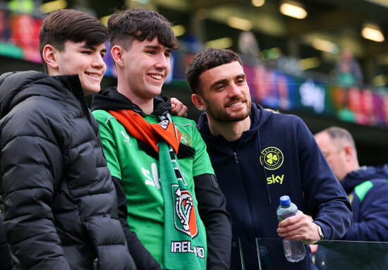 troy-parrott-takes-a-photo-with-fans-ahead-of-the-match