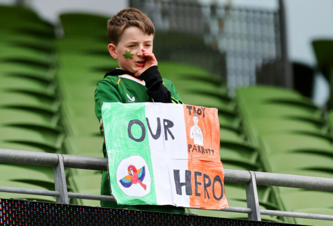 a-young-fan-holds-a-sign-for-troy-parrott-ahead-of-the-match