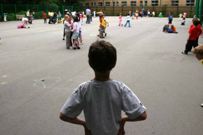 a-child-alone-in-a-school-playground-london-junior-school-image-shot-2004-exact-date-unknown