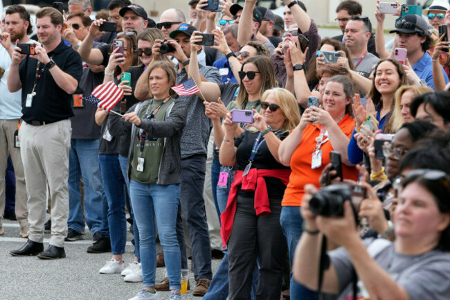 nasa-emplyees-react-as-astronauts-leave-the-operations-and-checkout-building-for-a-trip-to-launch-pad-39-b-and-a-planned-liftoff-on-nasas-artemis-ii-moon-rocket-at-the-kennedy-space-center-wednesday