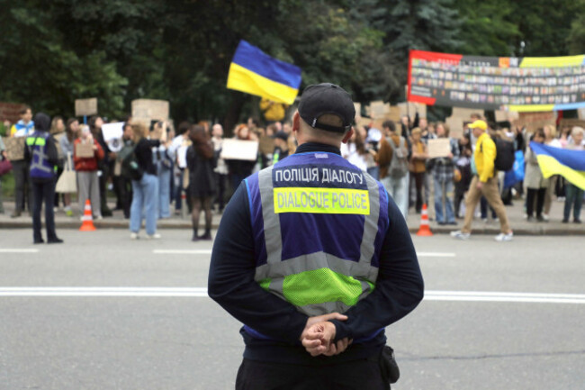 a-dialogue-police-officer-watches-activists-protest-against-law-n4555-ix-which-limits-the-powers-of-the-national-anti-corruption-bureau-nabu-and-the-specialised-anti-corruption-prosecutors-office