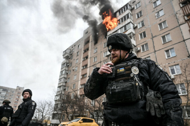 police-officers-stand-outside-an-apartment-block-where-a-fire-broke-out-caused-by-a-russian-guided-aerial-bomb-strike-zaporizhzhia-ukraine-december-17-2025-photo-by-dmytro-smolienkoukrinform
