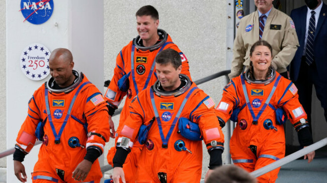astronauts-from-left-pilot-victor-glover-canadian-space-agency-astronaut-jeremy-hansen-commander-reid-wiseman-and-mission-specialist-christina-koch-leave-the-operations-and-checkout-building-on-t