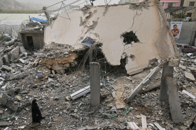 a-woman-checks-a-destroyed-house-that-was-hit-in-an-israeli-airstrike-in-saksakiyeh-village-south-lebanon-friday-april-3-2026-ap-photohussein-malla