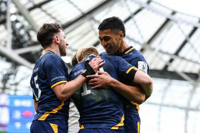 tommy-obrien-celebrates-with-hugo-keenan-and-rieko-ioane-after-scoring-his-sides-second-try