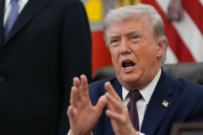 president-donald-trump-answers-questions-from-reporters-after-signing-an-executive-order-in-the-oval-office-of-the-white-house-tuesday-march-31-2026-in-washington-ap-photoalex-brandon