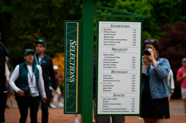 patrons-view-the-prices-of-food-items-on-a-board-during-a-practice-round-in-preparation-for-the-masters-golf-tournament-at-augusta-national-golf-club-tuesday-april-9-2024-in-augusta-ga-ap-photo