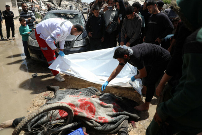gaza-april-06-2026-palestinians-inspect-the-remains-of-a-vehicle-after-it-was-bombed-by-israeli-aircraft-north-of-gaza-city-medical-sources-said-the-raid-killed-one-palestinian-and-injured-a-chil