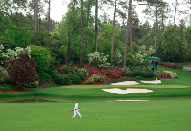 augusta-united-states-07th-apr-2025-chris-kirks-caddie-michael-cromie-walks-by-the-12h-hole-and-tours-amen-corner-before-play-is-suspended-due-to-lightning-and-thunderstorms-in-the-area-during-a