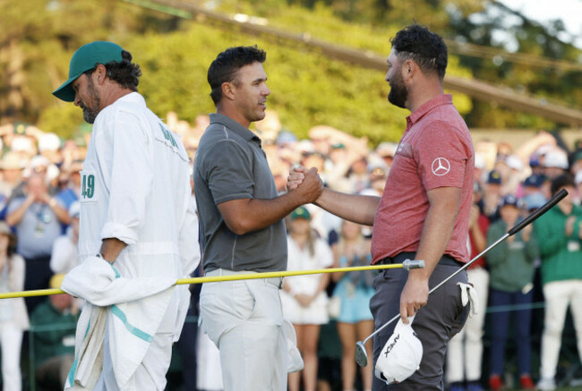 augusta-united-states-09th-apr-2023-brooks-koepka-shakes-hands-with-jon-rahm-of-spain-when-he-celebrates-on-the-18th-green-after-winning-the-87th-masters-tournament-in-the-final-round-at-augusta-n