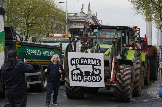 a-man-ha-a-photo-taken-next-to-vehicles-parked-on-oconnell-street-in-dublin-as-protestors-take-part-on-the-second-day-of-a-national-fuel-protest-against-rising-fuel-prices-demonstrators-driving-trac