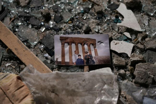 a-family-picture-sits-in-the-rubble-at-the-site-of-a-destroyed-building-that-was-hit-a-day-ahead-in-an-israeli-airstrike-in-central-beirut-lebanon-thursday-april-9-2026-ap-photohussein-malla