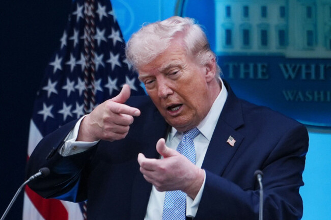 file-president-donald-trump-pretends-to-aim-a-sniper-gun-while-speaking-with-reporters-in-the-james-brady-press-briefing-room-at-the-white-house-monday-april-6-2026-in-washington-ap-photojuli