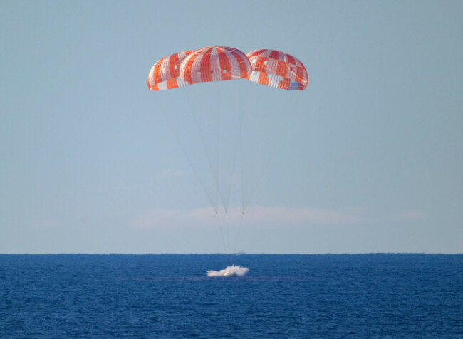 in-this-photo-provided-by-nasa-the-orion-spacecraft-with-artemis-ii-crewmembers-aboard-splashes-down-in-the-pacific-ocean-off-the-coast-of-california-friday-april-10-2026-bill-ingallsnasa-via-a