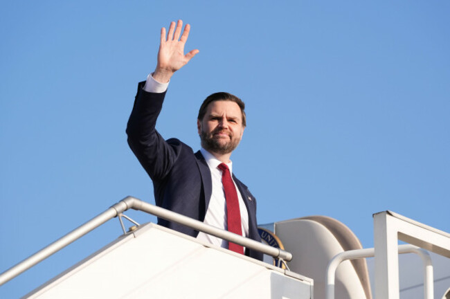 vice-president-jd-vance-waves-as-he-boards-air-force-two-after-attending-talks-on-iran-in-islamabad-pakistan-sunday-april-12-2026-ap-photojacquelyn-martin-pool