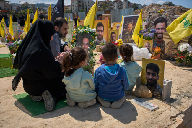 family-members-pray-at-the-grave-of-a-relative-buried-alongside-hezbollah-fighters-killed-in-israeli-strikes-in-a-cemetery-in-choueifat-lebanon-monday-april-13-2026-ap-photoemilio-morenatti