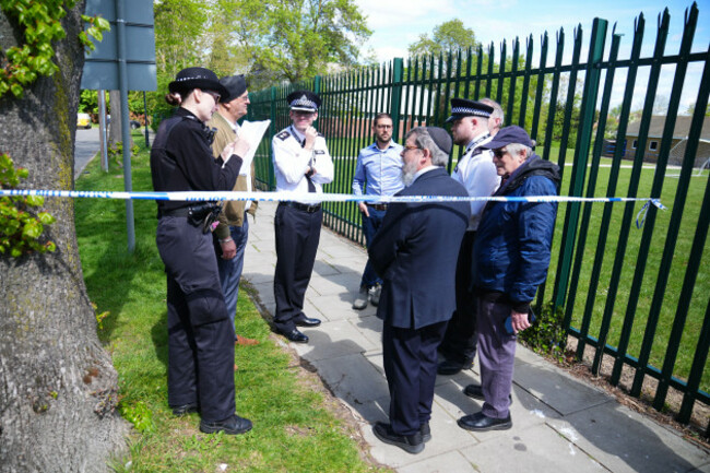 rabbi-yehuda-black-centre-identifies-himself-to-a-police-officer-as-he-enters-the-restricted-zone-outside-the-kenton-united-synagogue-in-harrow-north-west-london-where-an-attempted-arson-attack-ov