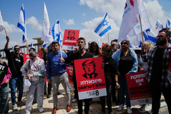 residents-of-northern-israel-living-near-the-lebanese-border-protest-the-security-situation-outside-the-u-s-embassy-in-jerusalem-sunday-april-19-2026-hebrew-on-a-sign-bearing-an-image-of-presiden