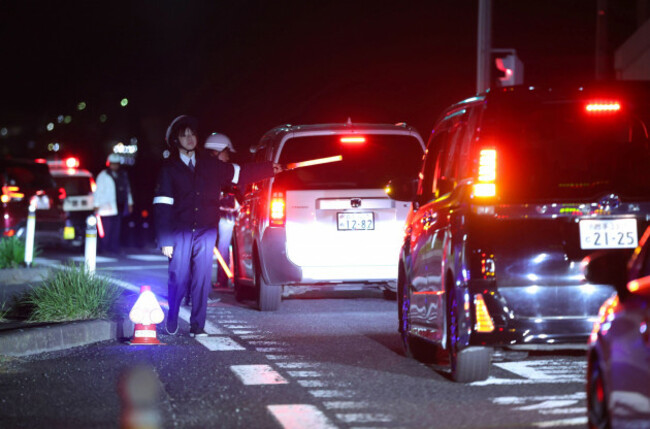 a-photo-shows-the-road-toward-the-coast-was-closed-by-police-after-the-off-the-coast-of-hokkaido-and-sanriku-subsequent-earthquake-advisory-that-struck-off-the-coast-of-iwate-prefecture-japan-on-apr