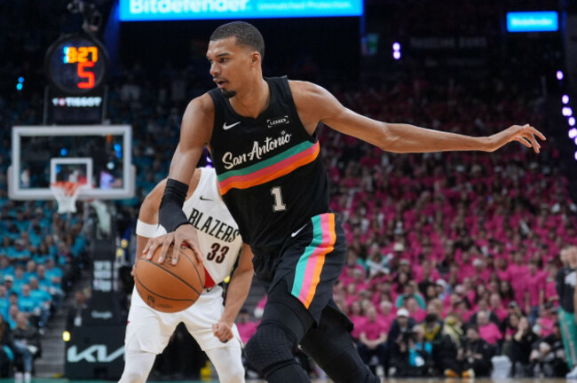 san-antonio-spurs-forward-victor-wembanyama-1-drives-past-portland-trail-blazers-forward-toumani-camara-33-during-the-second-half-in-game-1-of-a-first-round-nba-playoffs-basketball-series-in-san-a
