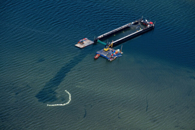 the-humpback-whale-stranded-in-the-baltic-sea-has-arrived-in-the-barge-intended-for-its-transportation-near-the-island-of-poel-germany-tuesday-april-28-2026-stefan-sauerdpa-via-ap