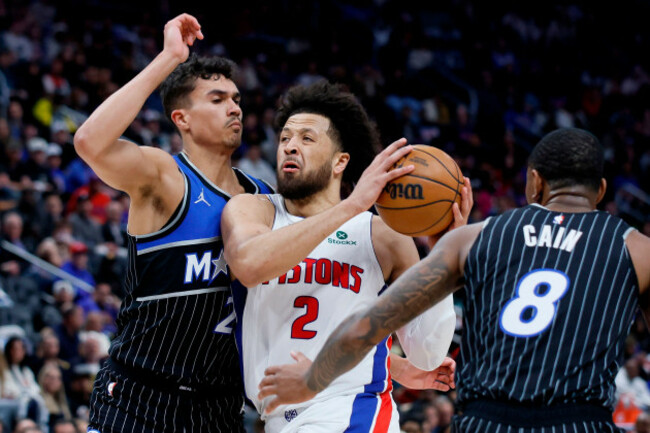 detroit-pistons-guard-cade-cunningham-2-goes-to-the-basket-between-orlando-magic-forward-tristan-da-silva-23-and-forward-jamal-cain-8-during-the-first-half-in-game-5-of-a-first-round-nba-basketb