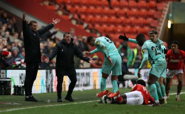 charlton-athletic-u18-coach-jason-pearce-left-and-first-team-coach-anthony-hayes-second-left-react-on-the-touchline-during-the-carabao-cup-fourth-round-match-at-the-valley-london-picture-date-w
