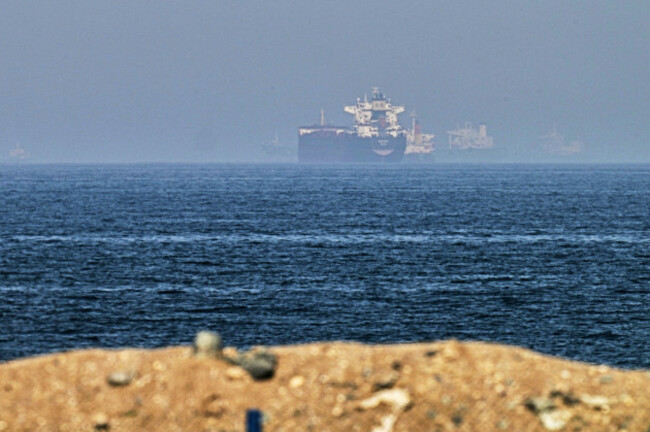 cargo-ships-are-seen-at-sea-near-the-strait-of-hormuz-as-viewed-from-a-rocky-shoreline-near-khor-fakkan-united-arab-emirates-friday-may-1-2026-ap-photofatima-shbair