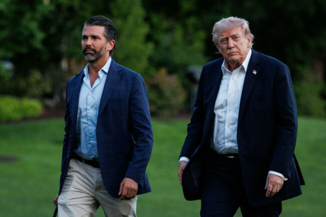 united-states-president-donald-j-trump-walks-across-the-south-lawn-of-the-white-house-in-washington-dc-usa-with-his-son-donald-trump-jr-after-landing-in-marine-one-on-may-3-2026-president-trump