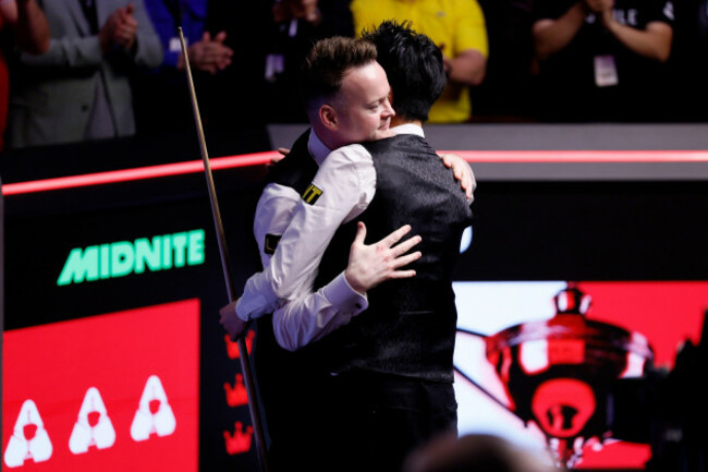 wu-yize-right-celebrates-winning-the-halo-world-snooker-championship-2026-final-against-shaun-murphy-left-at-the-crucible-theatre-sheffield-picture-date-monday-may-4-2026
