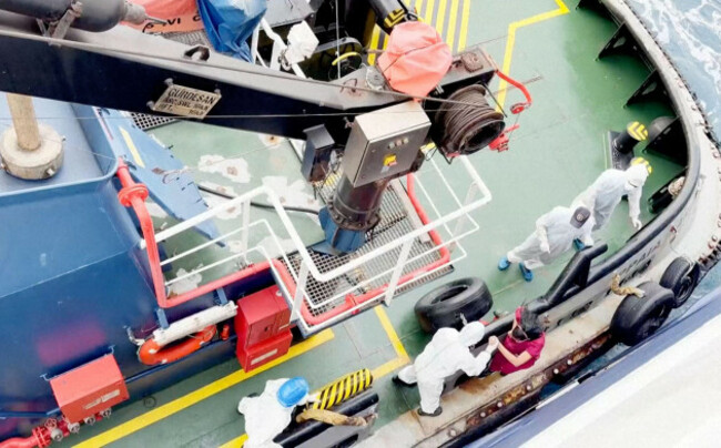 health-workers-get-off-the-dutch-flagged-mv-hondius-a-cruise-ship-carrying-nearly-150-people-as-it-remains-off-cape-verde-on-monday-may-4-2026-after-three-passengers-died-and-several-others-fell-se
