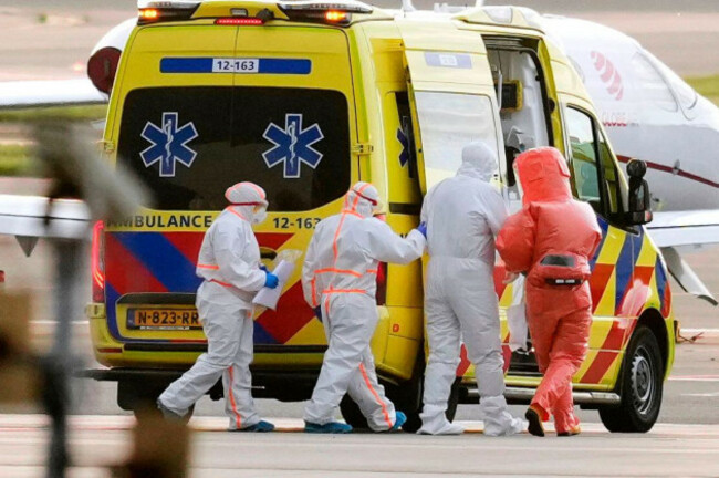 medics-escort-a-patient-second-right-evacuated-from-the-mv-hondius-cruise-ship-with-suspected-hantavirus-infection-to-an-ambulance-after-being-flown-to-schiphol-airport-amsterdam-netherlands-wed