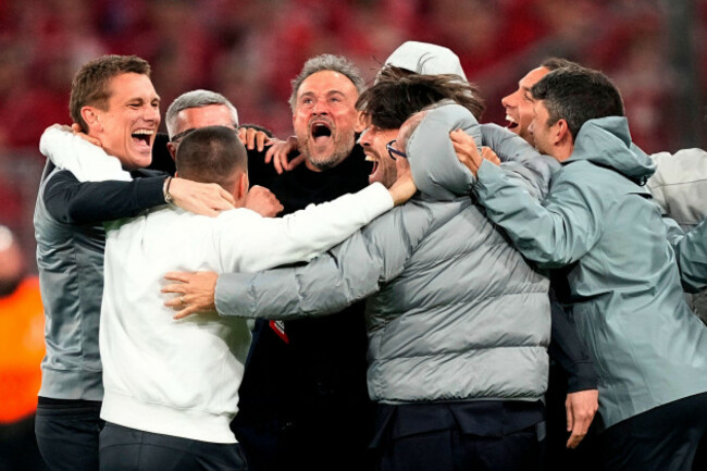 psgs-head-coach-luis-enrique-center-celebrates-with-the-other-members-of-the-team-after-the-champions-league-semifinal-second-leg-soccer-match-between-bayern-munich-and-paris-saint-germain-in-munic