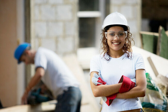 young-woman-on-a-construction-site-wearing-a-hard-hat