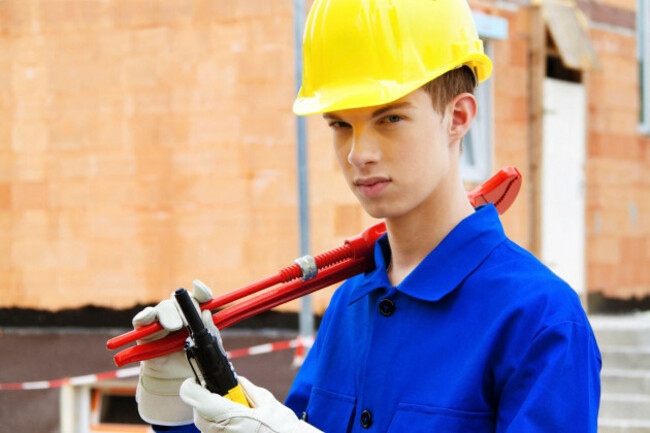 apprentice-trainee-construction-worker-on-site-with-he-image-shot-052012-exact-date-unknown