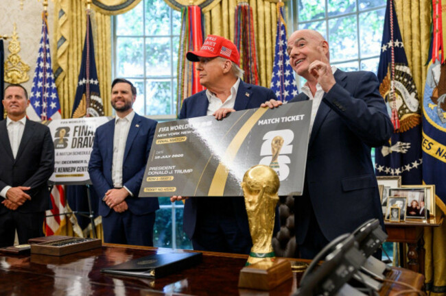 president-donald-j-trump-and-fifa-president-gianni-infantino-present-a-symbolic-oversized-match-ticket-for-the-2026-fifa-world-cup-final-during-an-oval-office-event-at-the-white-house-washington-d