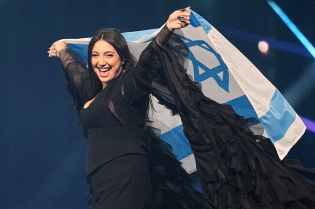 file-singer-yuval-raphael-from-israel-holds-the-national-flag-during-a-dress-rehearsal-for-the-grand-final-of-the-69th-eurovision-song-contest-in-basel-switzerland-friday-may-16-2025-ap-photo