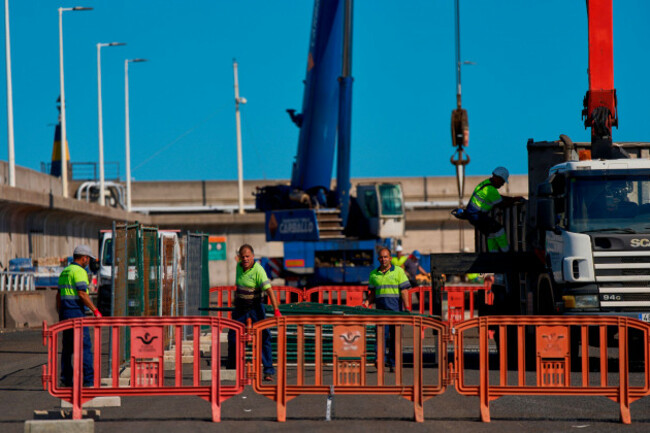 workers-prepare-the-area-where-passengers-from-the-mv-hondius-cruise-ship-are-expected-to-arrive-at-the-port-of-granadilla-in-tenerife-canary-islands-spain-friday-may-8-2026-ap-photomanu-ferna