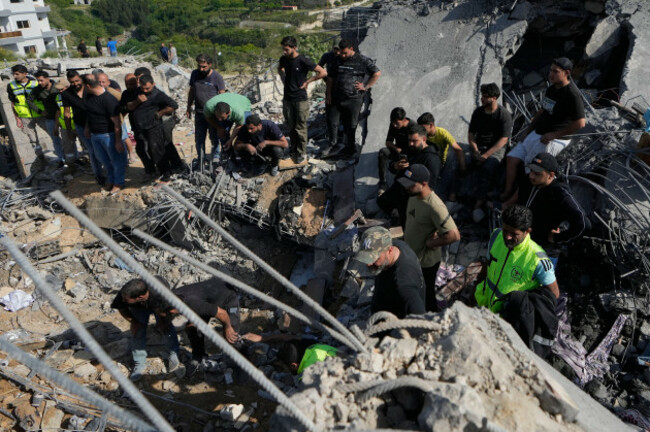 residents-gather-as-others-search-through-the-rubble-of-houses-damaged-by-an-israeli-airstrike-in-the-village-of-saksakieh-southern-lebanon-saturday-may-9-2026-ap-photomohammed-zaatari
