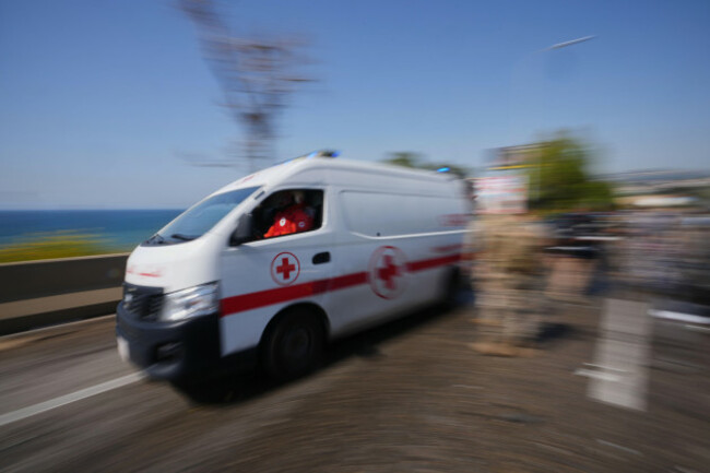an-ambulance-rushes-past-the-scene-of-an-israeli-airstrike-that-hit-a-car-in-the-coastal-town-of-saadiyat-south-of-beirut-lebanon-saturday-may-9-2026-ap-photohassan-ammar