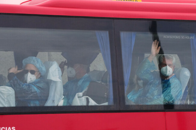 passengers-wave-inside-a-bus-after-being-disembarked-from-the-hantavirus-stricken-cruise-ship-mv-hondius-at-the-port-of-granadilla-in-tenerife-canary-islands-spain-sunday-may-10-2026-ap-photom