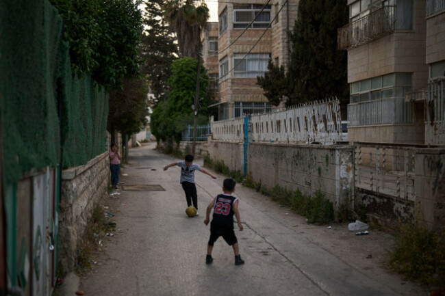 palestinian-boys-play-with-a-ball-in-an-alley-of-the-west-bank-town-of-al-ram-monday-may-11-2026-ap-photoleo-correa