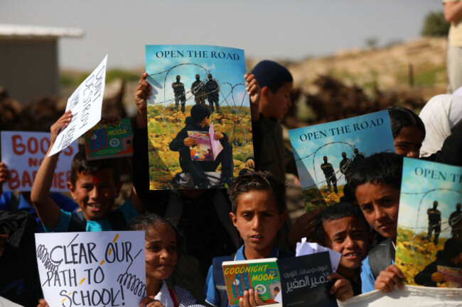 palestinian-students-continue-their-sit-in-and-study-on-the-side-of-a-road-which-has-been-closed-by-settlers-and-israeli-forces-preventing-them-from-reaching-their-schools-in-the-village-of-umm-al