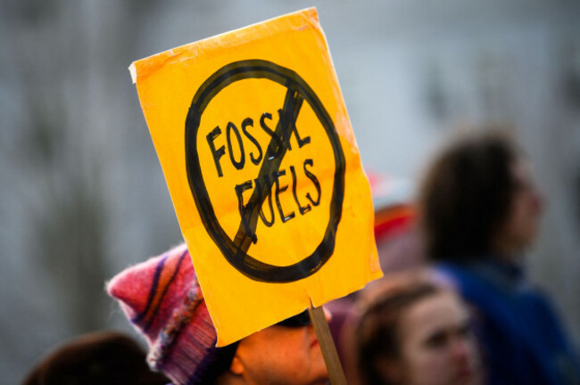 anti-fossil-fuels-sign-at-a-rally-calling-for-action-to-halt-climate-change-vermont-state-house-montpelier-vt-jan-27-2024