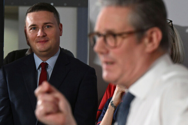 britains-health-secretary-wes-streeting-left-watches-as-britains-prime-minister-keir-starmer-gives-a-speech-on-reducing-nhs-wait-times-as-he-visits-a-healthcare-provider-in-surrey-england-monday